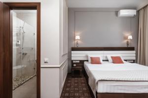 Кровать или кровати в номере Гостиница Сокол