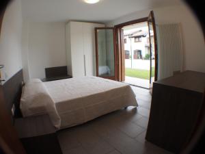 Un pat sau paturi într-o cameră la Alloggio Agrituristico Ai Tre Castelli