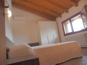 Postel nebo postele na pokoji v ubytování Alloggio Agrituristico Ai Tre Castelli