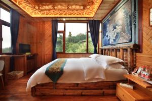Baike Boutique Hotel客房内的一张或多张床位