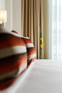 Sandal Suites by Lemon Tree Hotels客房内的一张或多张床位