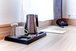 Příslušenství pro přípravu čaje a kávy v ubytování Hotel Koflík
