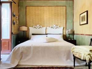 Voodi või voodid majutusasutuse Il Salotto di Maria Pia toas