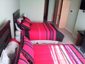 Ένα ή περισσότερα κρεβάτια σε δωμάτιο στο Hotel Astore Suites