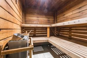 a wooden sauna with a trash can in it at Résidence Pierre & Vacances Premium Les Alpages de Chantel in Arc 1800 +61 photos