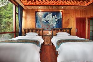 Baike Boutique Hotel客房内的一张或多张床位
