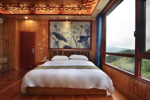 Baike Boutique Hotel客房内的一张或多张床位