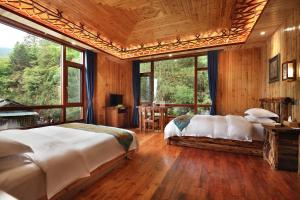 Baike Boutique Hotel客房内的一张或多张床位