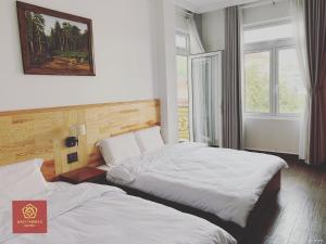 Voodi või voodid majutusasutuse Bảo Thịnh 2 Hotel toas