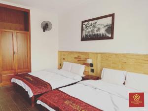 Voodi või voodid majutusasutuse Bảo Thịnh 2 Hotel toas