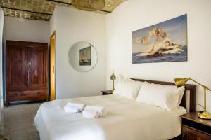 En eller flere senge i et værelse på LaVistaDeiSogni Antica