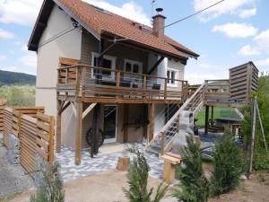 a house with a deck and a balcony at spa et wellness in Xonrupt-Longemer