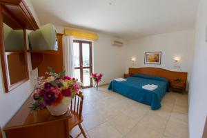 Voodi või voodid majutusasutuse Hotel Orchidea toas
