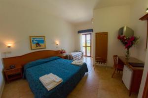 Voodi või voodid majutusasutuse Hotel Orchidea toas