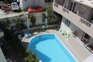 Бассейн в El Greco Apartments или поблизости