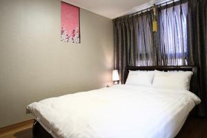 Rúm í herbergi á Residence Hotel Lamia
