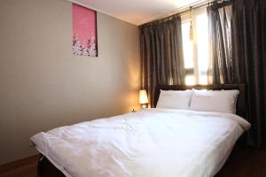 Rúm í herbergi á Residence Hotel Lamia