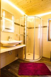 a bathroom with a sink and a shower at Ferienwohnung Haus Sonja in Ramsau