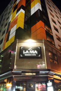 a building with a sign on the side of it at Residence Hotel Lamia in Daejeon