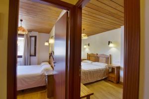 A bed or beds in a room at Apartaments La Peguera II