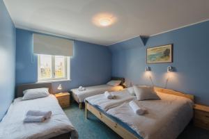 Кровать или кровати в номере Kuressaare Central Hostel