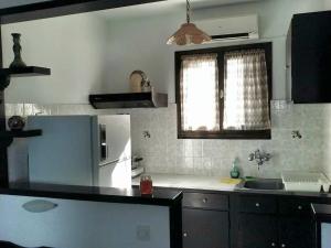 Kuchyň nebo kuchyňský kout v ubytování Olga Paltsi Rooms + 37 fotografií