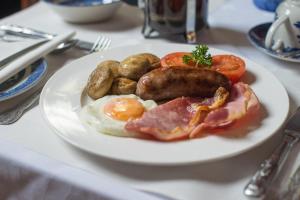 a plate of breakfast food on a table at Jeakes House in Rye