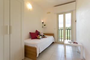 Una cama o camas en una habitación de Al Ficodindia