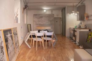 a kitchen with a table and chairs in a room at CasaMia in Rome