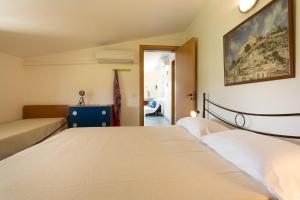 Una cama o camas en una habitación de Al Ficodindia