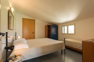 Una cama o camas en una habitación de Al Ficodindia