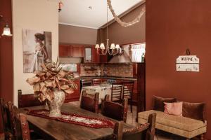 a kitchen with a table with a vase on it at Villa Loridis in Prinos
