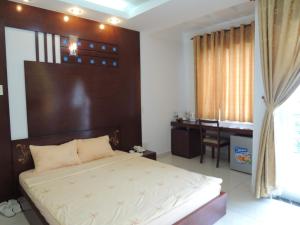 Giường trong phòng chung tại Alupoint Hotel