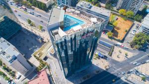an overhead view of a building with a swimming pool at Icon Hotel in Santiago