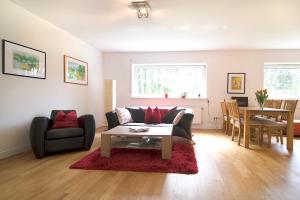 a living room with a couch and a table at Eifel Relax in Hillesheim