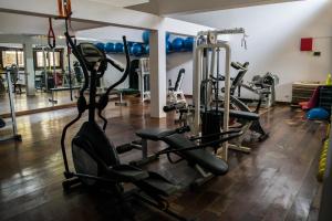 a gym with several tread machines in a room at Las Cabañas de Antica in Vichayito