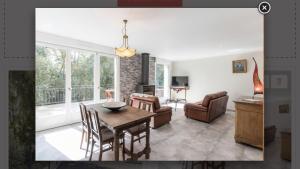 a living room with a dining room table and chairs at Metris gaelle in Corre