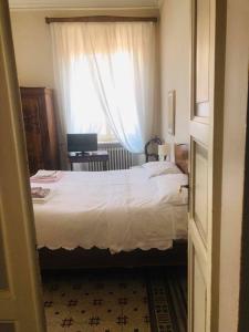 Posteľ alebo postele v izbe v ubytovaní Attico Luce B&B