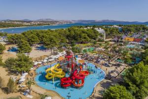 an aerial view of a water park with a water slide at Studio apartman, 2+1 in Brodarica
