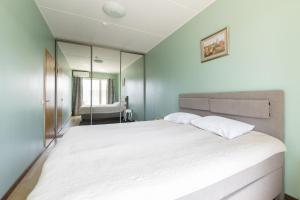 Postel nebo postele na pokoji v ubytování Foorum City Centre Apartment