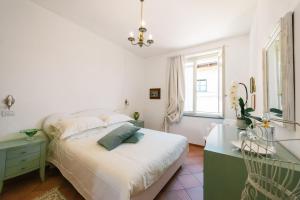 Postel nebo postele na pokoji v ubytování BB Porta Augustea - Fano
