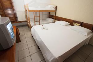 Postel nebo postele na pokoji v ubytování Chauã Porto Hotel