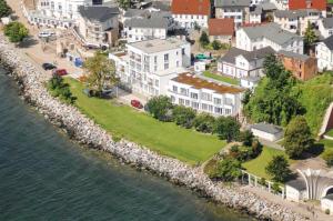 an aerial view of a house next to the water at Penthouse Ostseeresidenz in Sassnitz