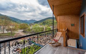 a room with a balcony with a bunch of bikes at Rivendell in Borjomi