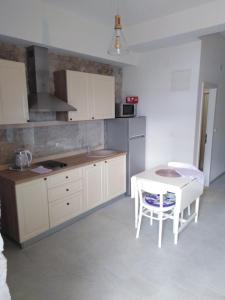 Kuchyň nebo kuchyňský kout v ubytování Apartment Iris + 1 fotografie