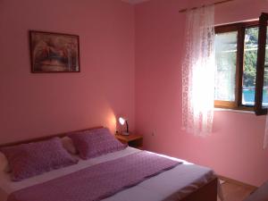 Un pat sau paturi într-o cameră la Apartment Josip II