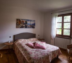 Katil atau katil-katil dalam bilik di Appartamenti Il Medeghino