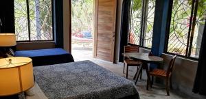 Postel nebo postele na pokoji v ubytování Ananda Guesthouse