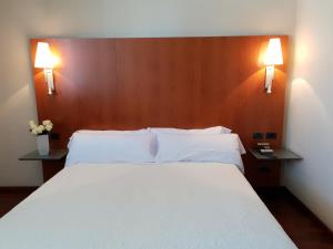 Un pat sau paturi într-o cameră la Sant bonifaci petrer