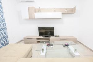 TV a/nebo společenská místnost v ubytování Apartamento Sol